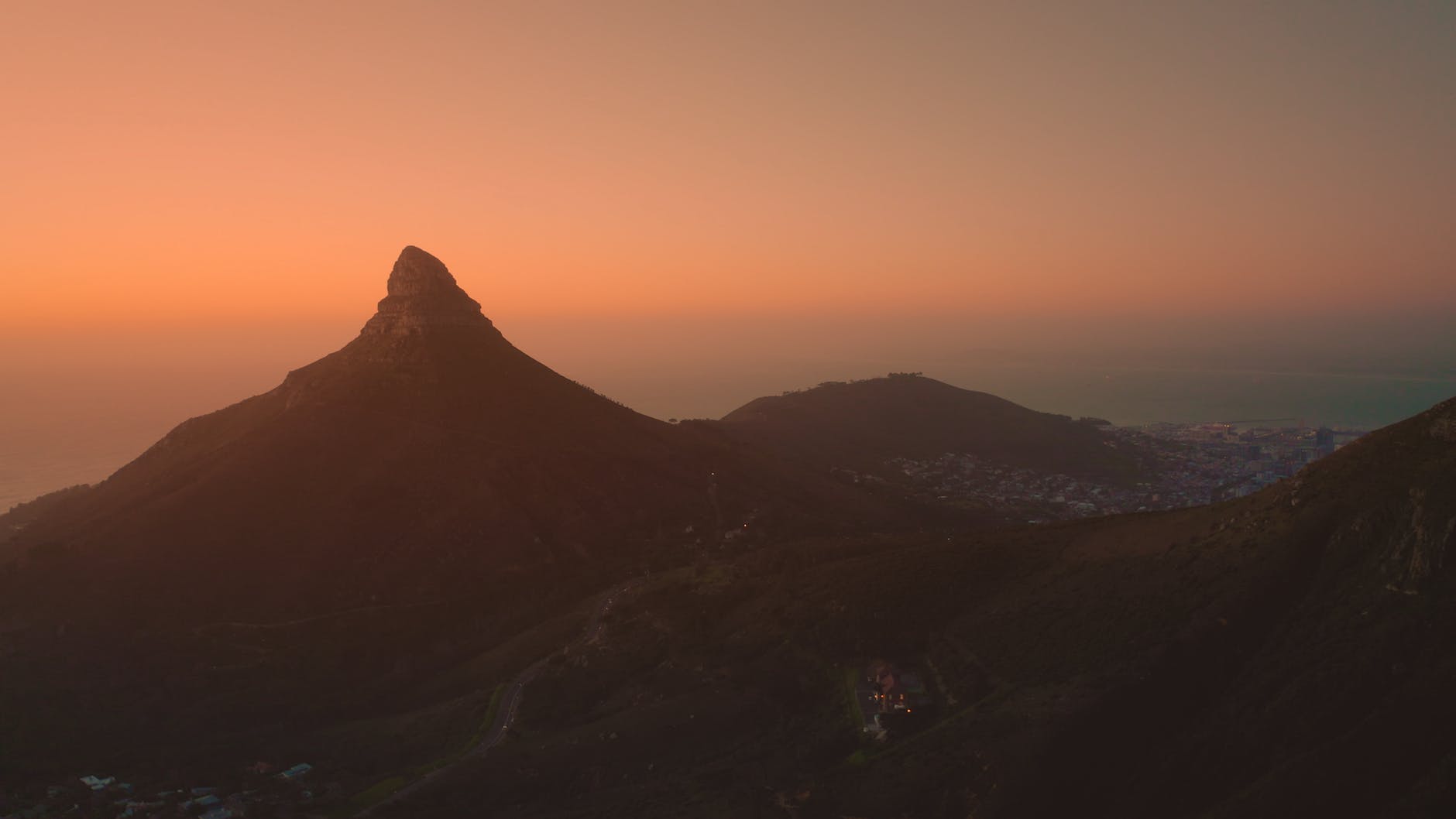 silhouette of lions head mountain during sunset