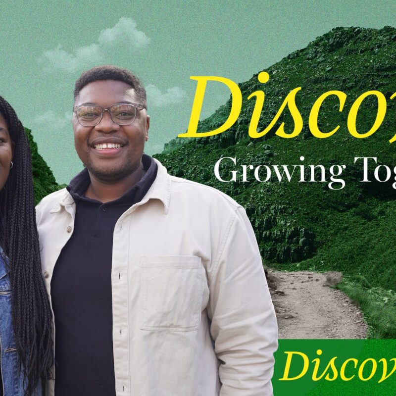 A promotional image with two smiling people, a woman with long braids and a man with short hair and glasses, standing in front of green, hilly mountains. Overlaid text reads "Discover Growing Together" in yellow, and "Discover Jesus" in green.
