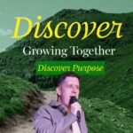 A man in a grey jacket holds a microphone, speaking, against a backdrop of green, rocky hills and a path leading up. The word "Discover" is written in large yellow script at the top. Below it, in white, are the words "Growing Together," and in a green box, "Discover Purpose."