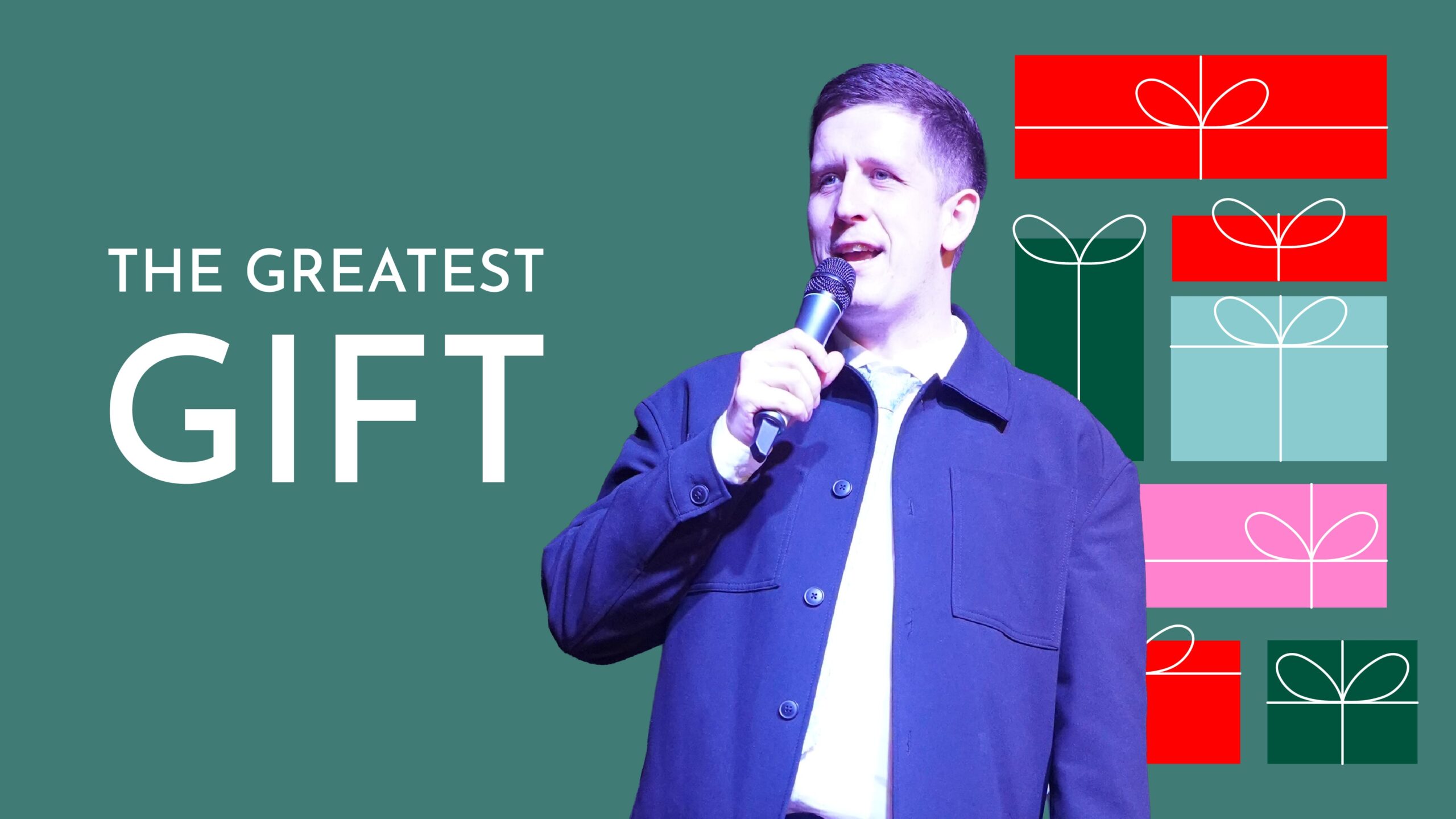 Pastor Josh Cooke speaking into a microphone on a stage. The graphic has a green background and is titled "THE GREATEST GIFT". To the side is a stack of stylized red, green, blue, and pink Christmas presents.